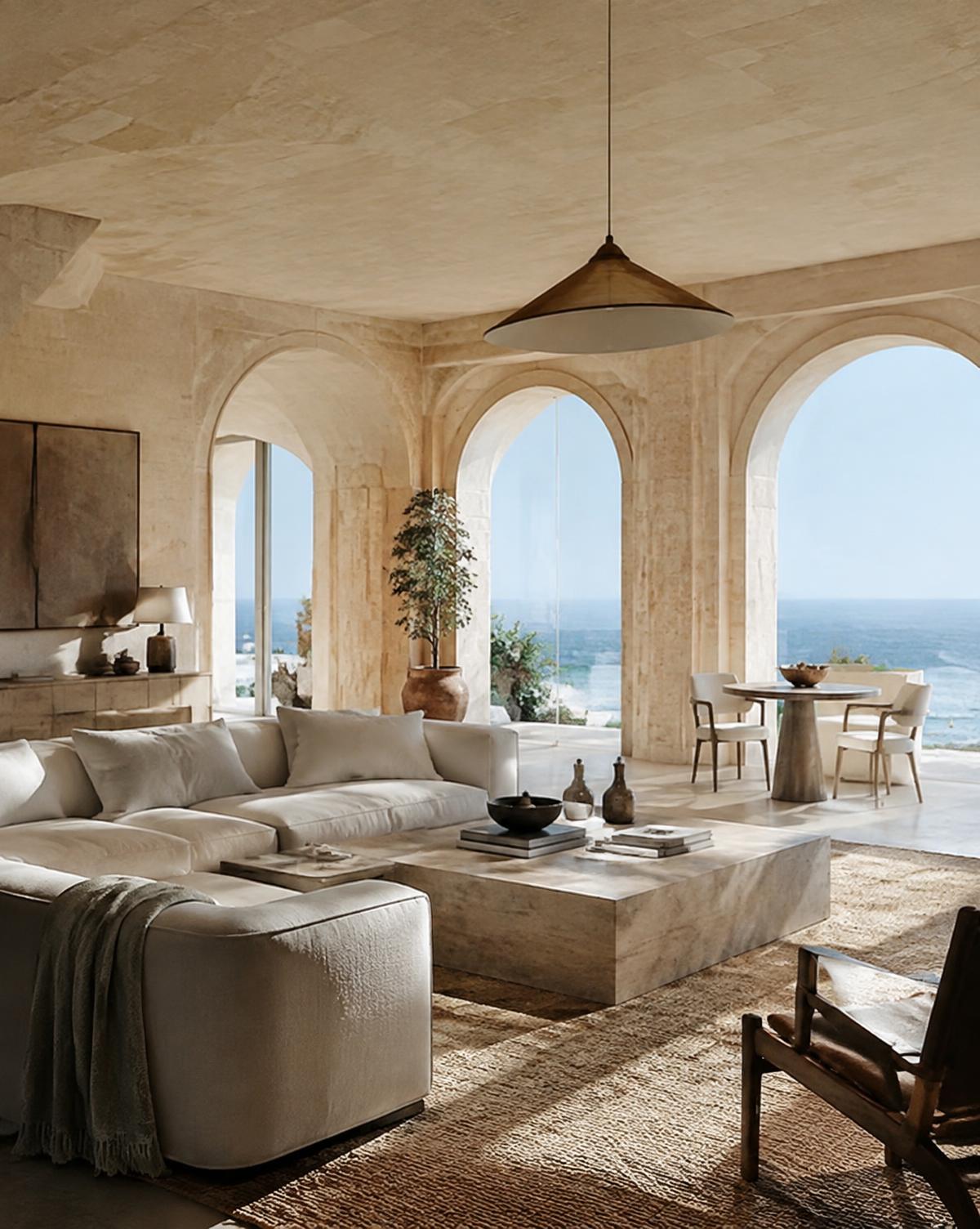 Limestone villa living room with arched windows to the sea